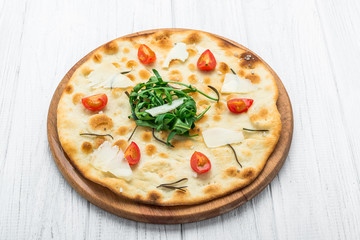 Traditional Italian Focaccia with tomatoes, black olives and rosemary - homemade flat bread focaccia