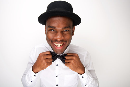 Close Up Smiling African American Man Adjusting His Bowtie