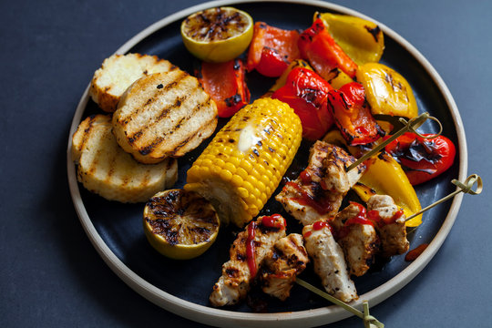 Grilled chicken skewers with peppers and sweetcorn