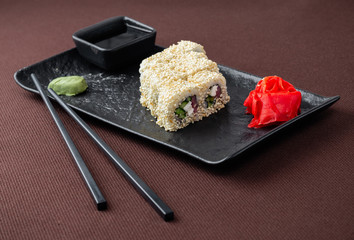 sushi on a black plate