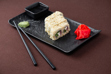 sushi on a black plate