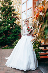 Portrait of a young beautiful bride with a bouquet