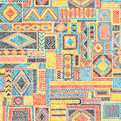 Embroidered seamless pattern. Geometric print for textiles. Carpet, rug, bedding hand-drawn. Red, blue, yellow and orange shades. Vector illustration.