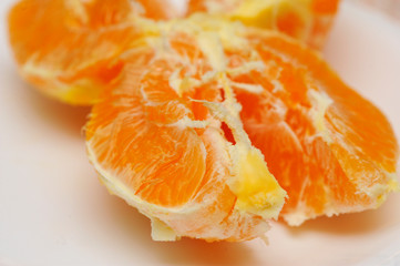 Slice of fresh orange fruit. Macro shoot of fresh orange. Orange background