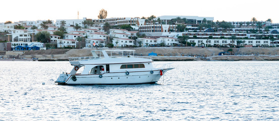 Fototapeta premium White Yacht In Blue Bay