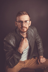 Stylish guy with glasses and a jacket. Casual style