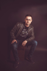 Stylish guy with glasses and a jacket. Casual style