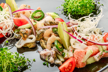 Thai spicy and sour seafood salad on a wooden table