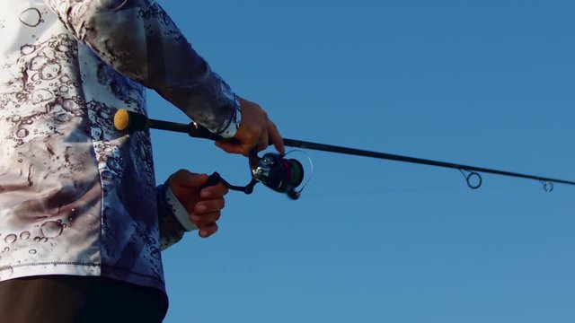 Fisherman with Rod and Reel - Slow Motion