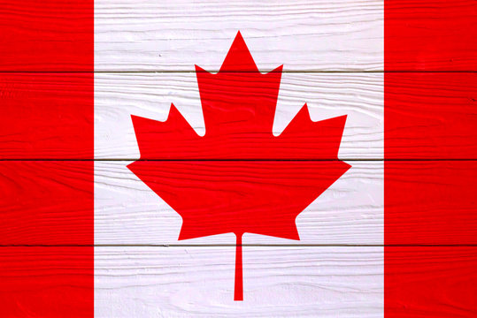 Canadian flag on a wooden background