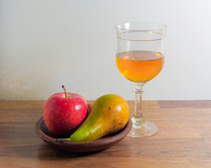 Wine glass with wine and fruits. Still life.