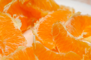 Slice of fresh orange fruit. Macro shoot of fresh orange. Orange background