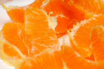 Fototapeta na wymiar Slice of fresh orange fruit. Macro shoot of fresh orange. Orange background