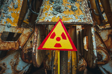 Radiation Sign - triangular warning yellow sign of radiation hazard in the zone of radioactive...