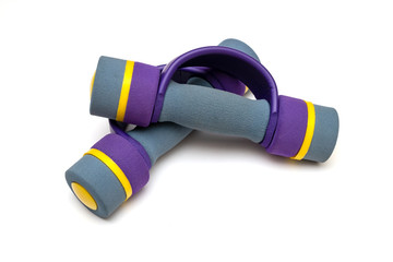 two soft dumbbells for children lie on a white background