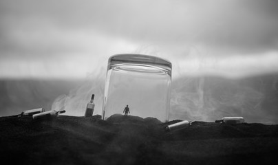 Iron handcuffs for the arrest of criminals, a glass of vodka on a wooden. background. a crime...