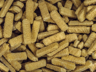Frozen chicken sticks breaded in the freezer