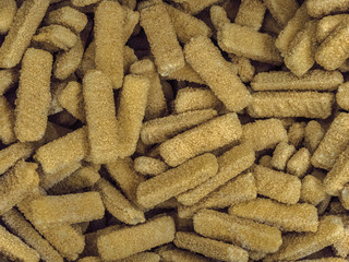 Frozen chicken sticks breaded in the freezer