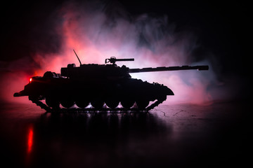 War Concept. Military silhouettes fighting scene on war fog sky background, World War German Tanks...