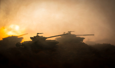 War Concept. Military silhouettes fighting scene on war fog sky background, World War Soldiers Silhouettes Below Cloudy Skyline at sunset. Attack scene. Armored vehicles.
