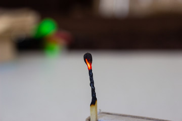 extinguished match on white background