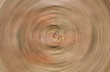 Radial texture background in reddish clay colors swirling swirl