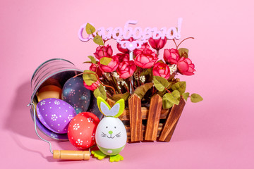 Colorful Easter eggs on pink background. The inscription in Russian with Love. Easter holiday.