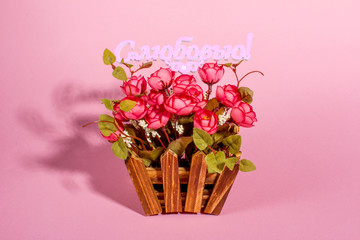 Pink roses on pink background. The inscription in Russian with love.