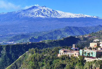 Fototapeta na wymiar Mount Etna volcano viewed from the town and countryside of Taormina in Sicily, Italy