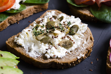 sandwiches with various fillings: ham, cheese, avocado, sauce