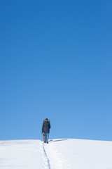 Walking the Snow Trail towards the Deep Blue Sky
