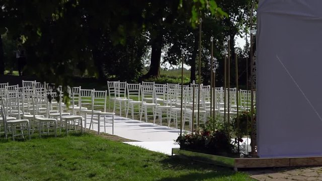 Chiavari chairs are displayed on the lawn.