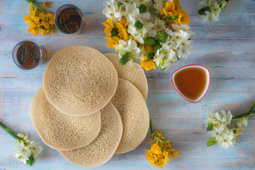 Moroccan pancakes Baghrir or crapes with 1000 holes served with honey, tea with nana , with...