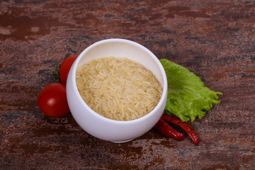 Raw uncooked rice in the bowl
