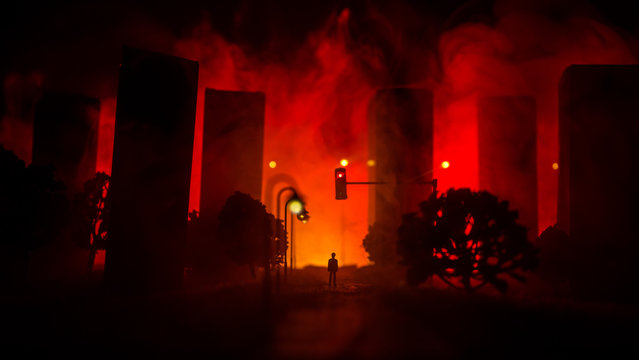 Artwork Decoration. A Man Standing On A Road Of Burnt Up City. Apocalyptic View Of City Downtown As Disaster Film Poster Concept. Night Scene. City Destroyed By War.