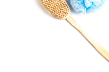 Wooden body brush and sponge for massage and scrub on white background with copy space - skincare in shower and bath
