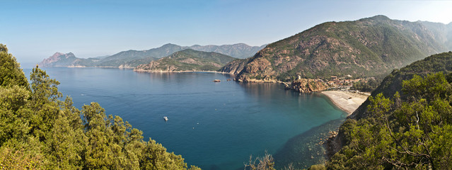 View of rocky coastline and small beach Porto Ota on Corsica island