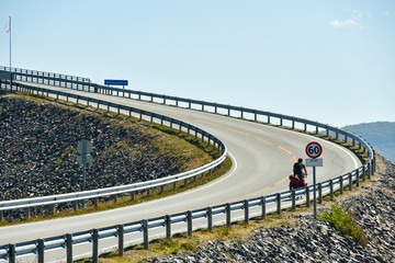 travel by bicycle on storseisundet bridge of norway