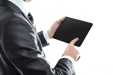 close up. businessman tapping the screen of the digital tablet