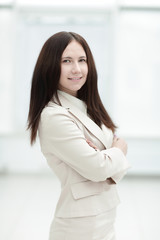 portrait of young business woman on office window background