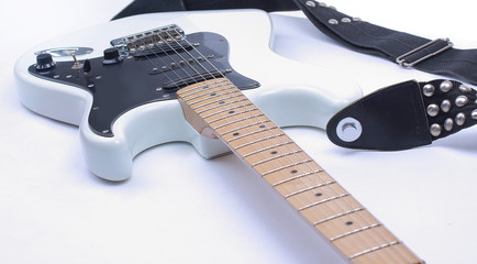 Fototapeta na wymiar closeup black and white electric guitar.isolated on a white bac