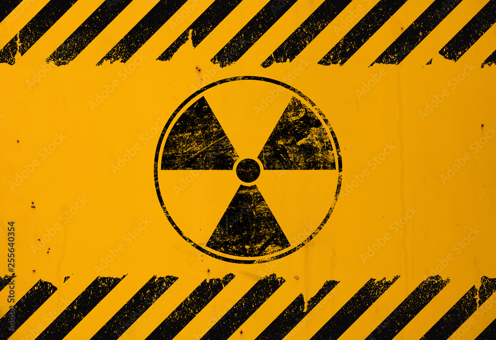 Wall mural black radioactive sign over yellow background - Wall murals