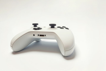 White joystick gamepad, game console isolated on white background. Computer gaming technology play competition videogame control confrontation concept. Cyberspace symbol