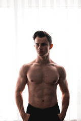 An upper body free bodybuilder with a deflected body and good abs. abdominal muscles, ripped, body,...
