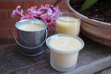 beeswax candles and pink flowers