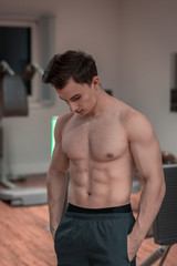 Fototapeta premium An upper body free bodybuilder with a deflected body and good abs. abdominal muscles, ripped, body, strong