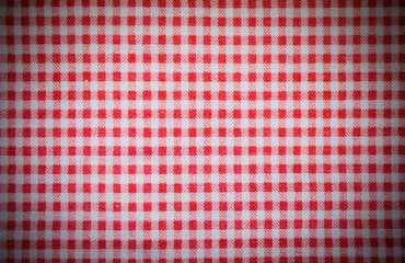 red textile checkered towel texture with vignette. background, kitchen.