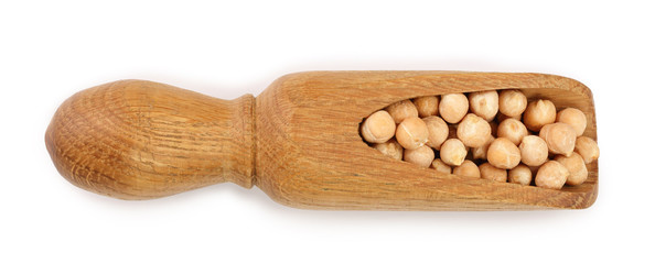 Dry raw organic chickpeas in wooden scoop isolated on white background. Top view