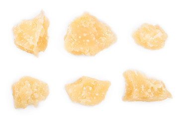 Parmesan cheese pieces isolated on white background. Closeup. Top view. Flat lay
