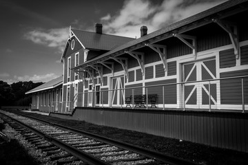 Fototapeta na wymiar Train station in black and white monochrome